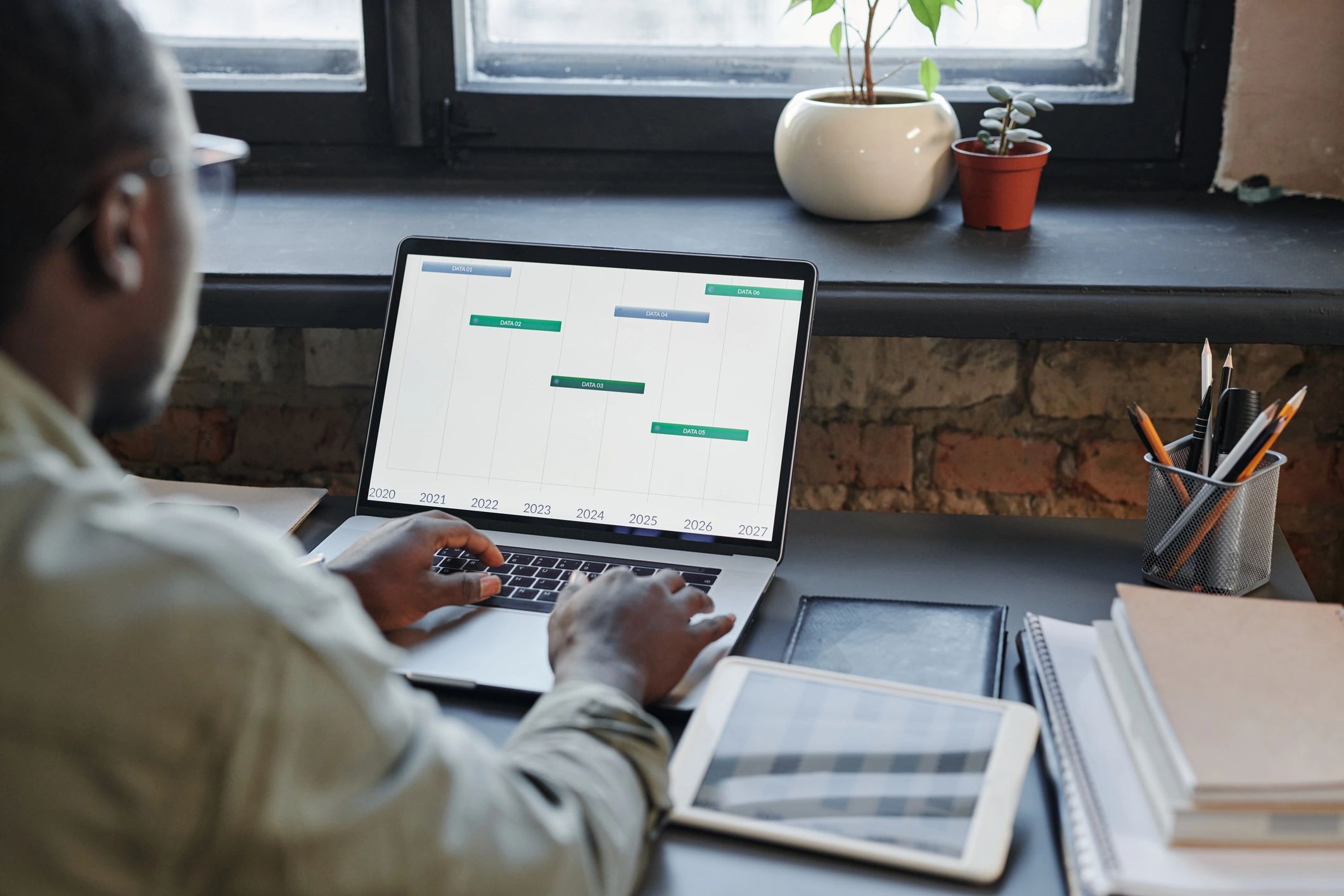 Professional client representative working at a laptop