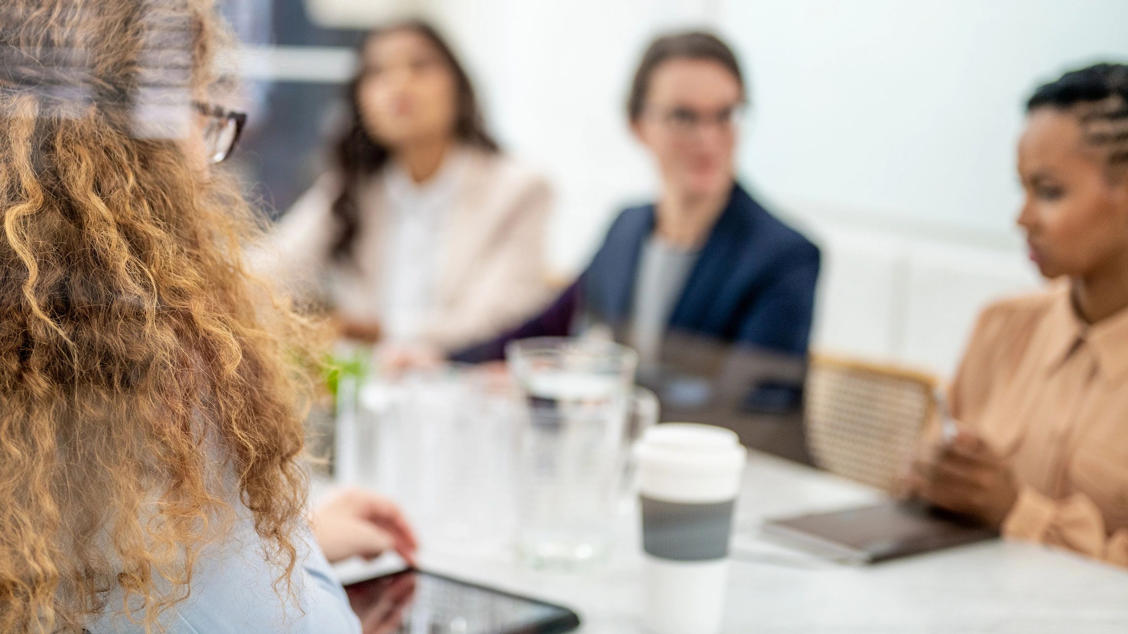 Professionals discussing business strategy at a meeting table